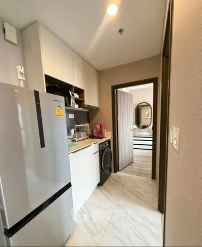 Modern kitchen with sleek design and open layout, featuring contemporary appliances and stylish decor.