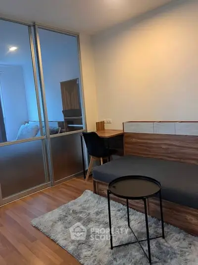 Modern studio apartment with cozy living area and stylish decor