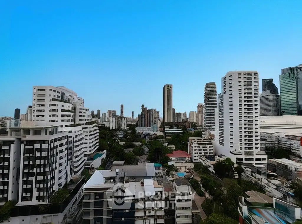 Stunning cityscape view from a high-rise balcony showcasing modern architecture and vibrant skyline.