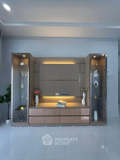 Modern living room with elegant built-in shelving and soft ambient lighting