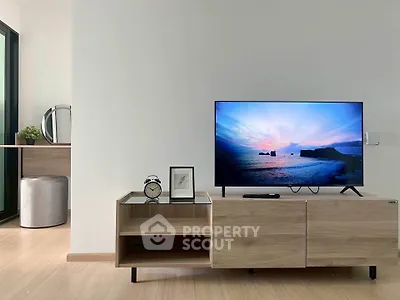 Modern living room with sleek TV stand and scenic view on screen
