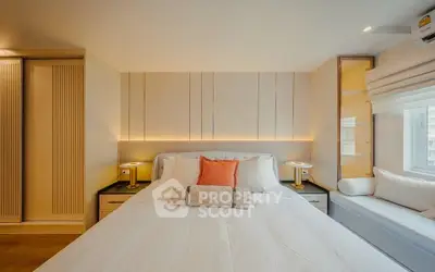 Luxurious bedroom with elegant lighting and cozy window seat