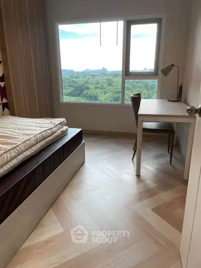 Modern bedroom with scenic view and study desk, perfect for serene living.