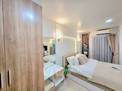 Modern bedroom with cozy decor, wooden wardrobe, and soft lighting in a stylish apartment.