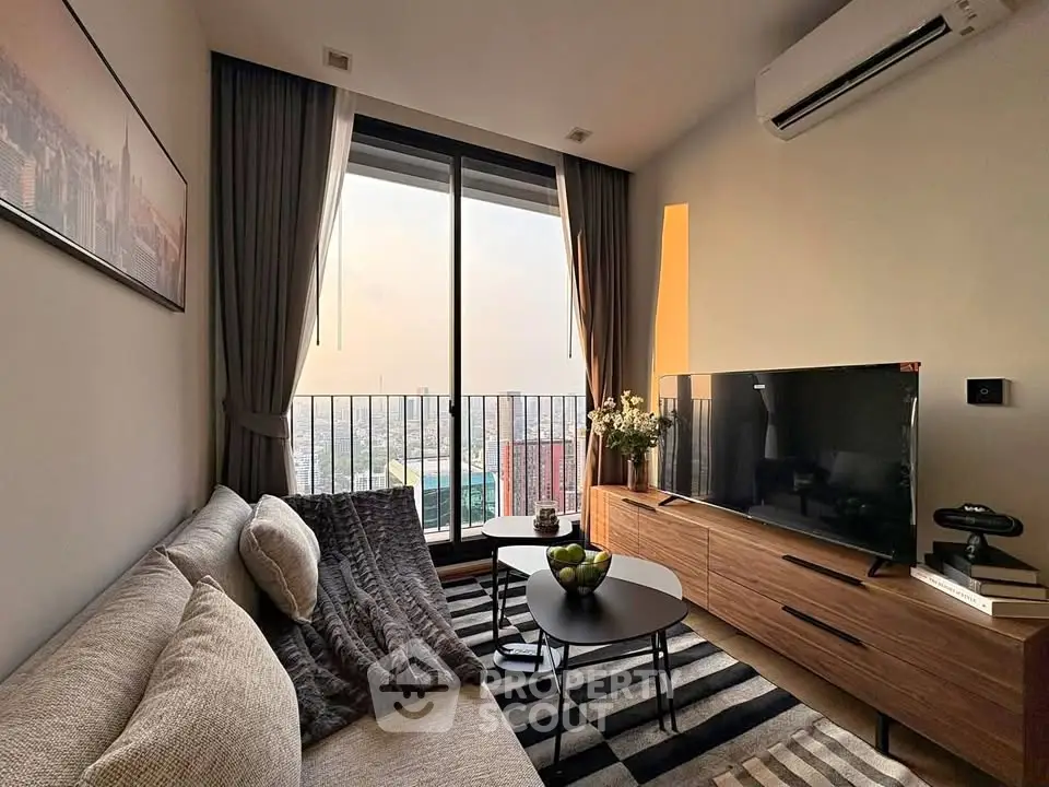 Modern living room with city view, cozy sofa, and stylish decor in high-rise apartment.