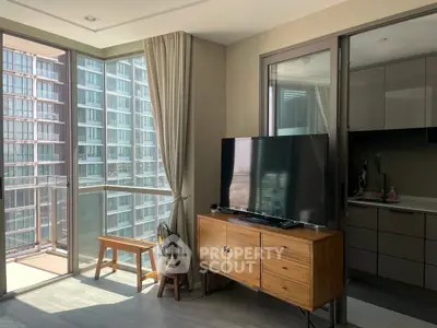 Modern living room with large windows and balcony in a high-rise apartment