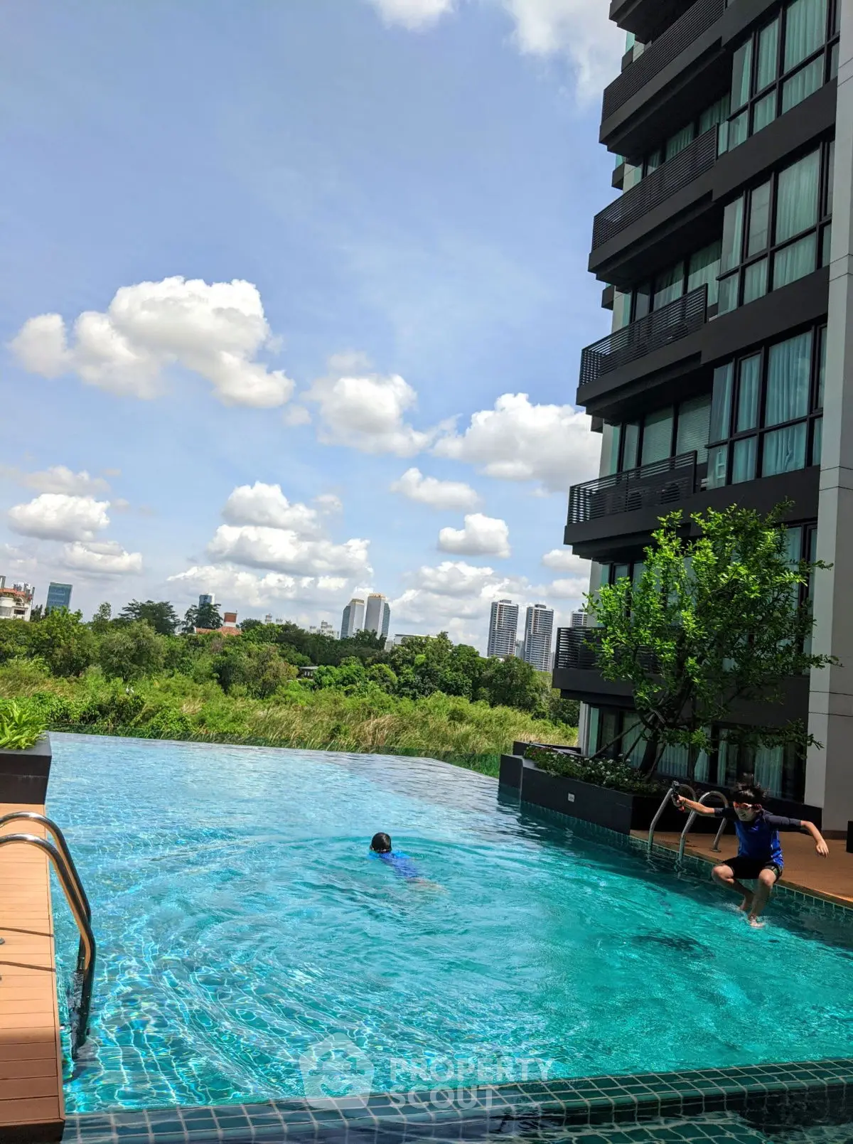 Luxurious condominium with stunning pool and city skyline view