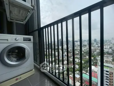 High-rise balcony with washing machine and stunning city skyline view