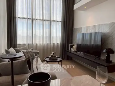 Luxurious modern living room with high ceilings and large windows