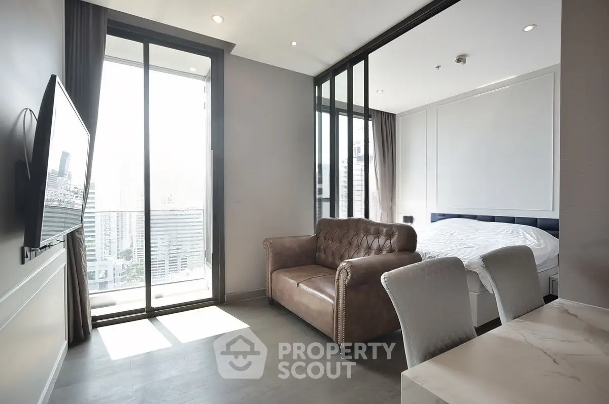 Modern studio apartment with city view and stylish furnishings