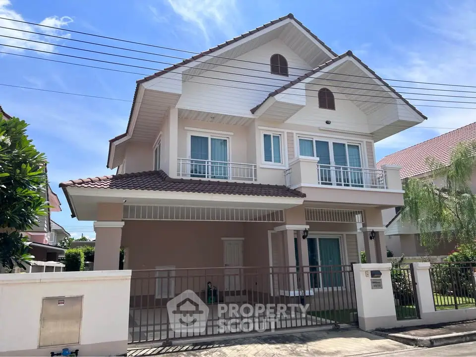 Charming two-story house with spacious balcony and modern design in a serene neighborhood.