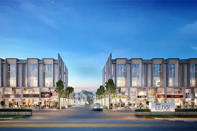 Modern commercial building exterior with shops and evening ambiance