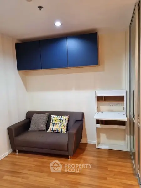 Modern living room with cozy sofa and sleek storage solutions