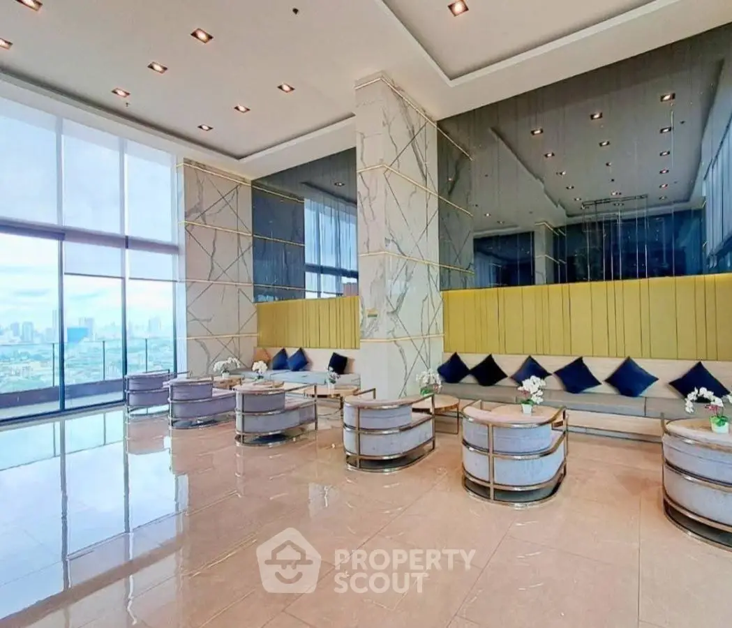 Luxurious modern lobby with panoramic city view and elegant seating area.