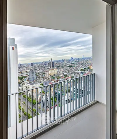 Stunning high-rise balcony with panoramic city views, perfect for urban living enthusiasts.