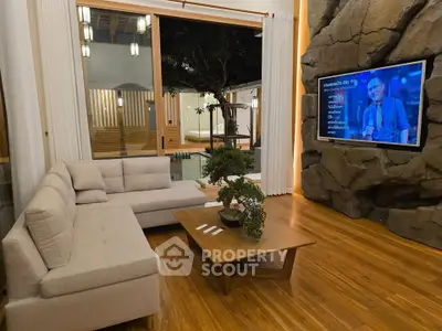 Luxurious living room with modern decor and large window view