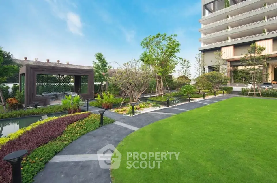 Luxurious garden view with modern building and lush landscaping