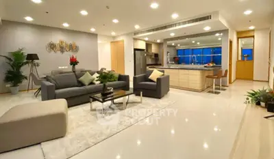 Spacious modern living room with open kitchen and stylish decor