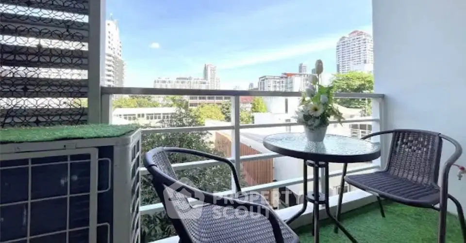 Charming balcony with city view, perfect for relaxation and enjoying the outdoors.