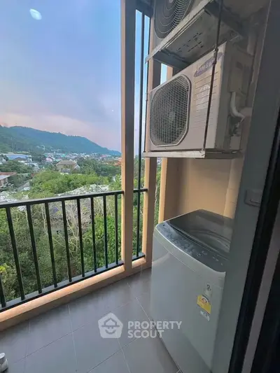 Charming balcony with scenic view and modern appliances, perfect for relaxation and utility.