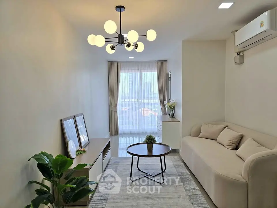 Modern living room with stylish lighting and cozy sofa in a bright apartment.