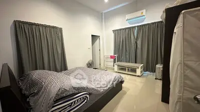 Spacious bedroom with modern decor and air conditioning