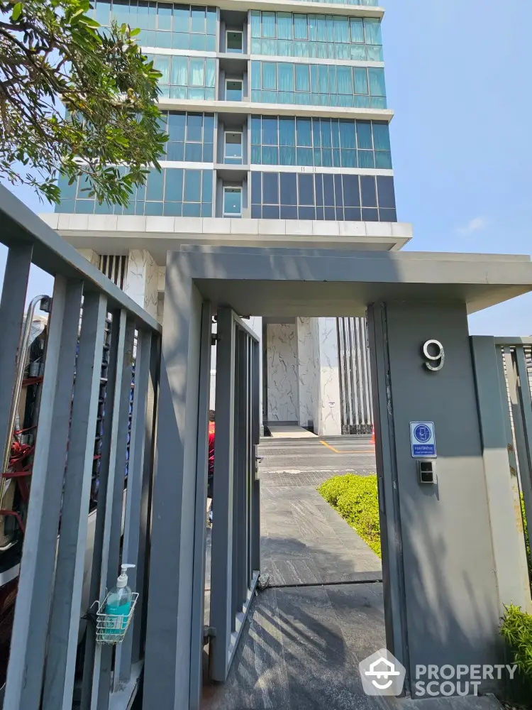 Modern high-rise building entrance with sleek design and secure access