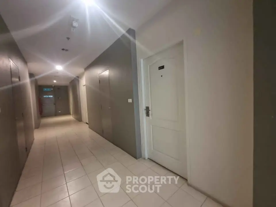Modern apartment corridor with sleek design and ambient lighting