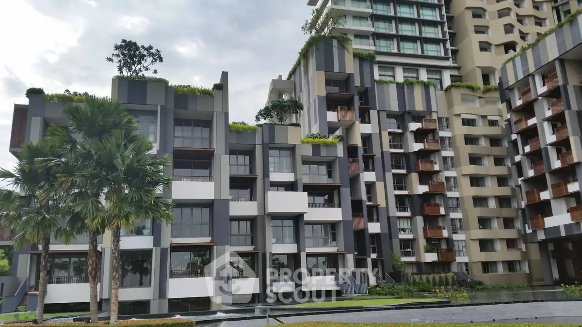 Modern architectural building with lush greenery and unique facade design