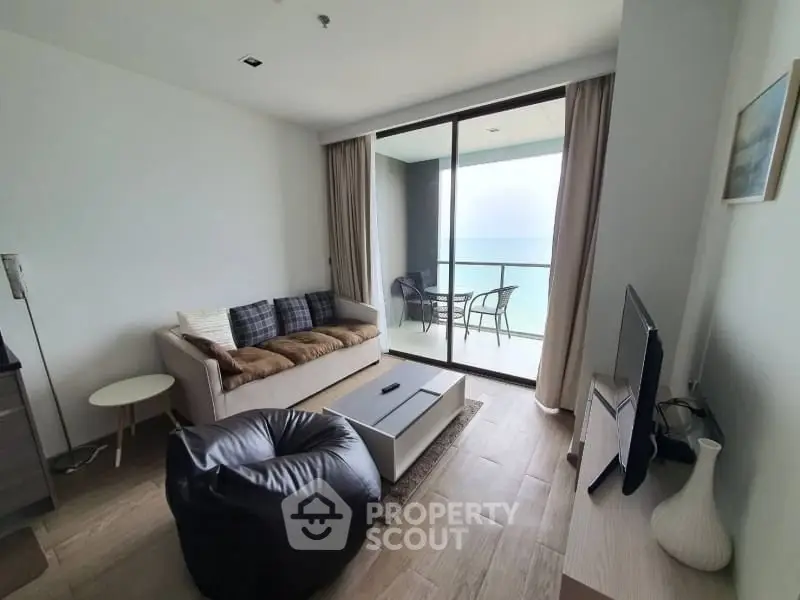 Modern living room with ocean view and balcony access