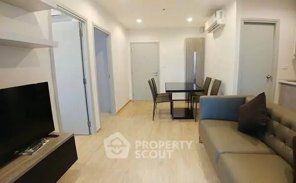 Modern living room with dining area and sleek furniture