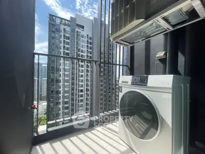 Modern balcony with washing machine and stunning city view in high-rise apartment.