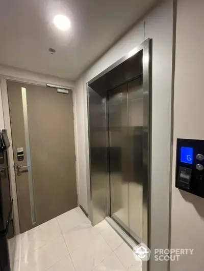 Modern apartment elevator with sleek design and secure access door.