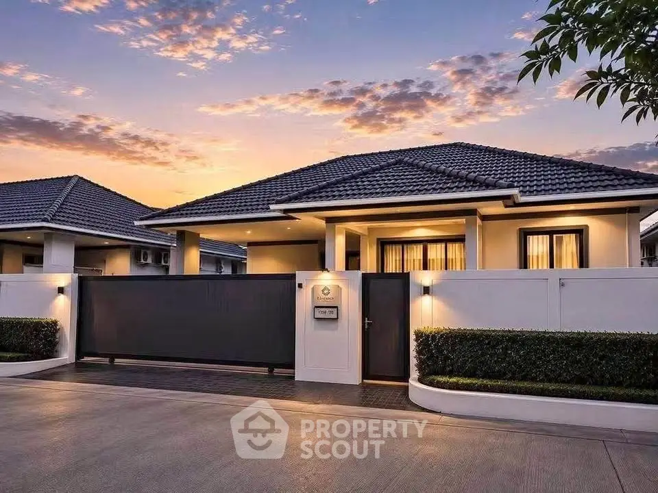 Stunning modern house exterior at sunset with sleek design and lush landscaping.