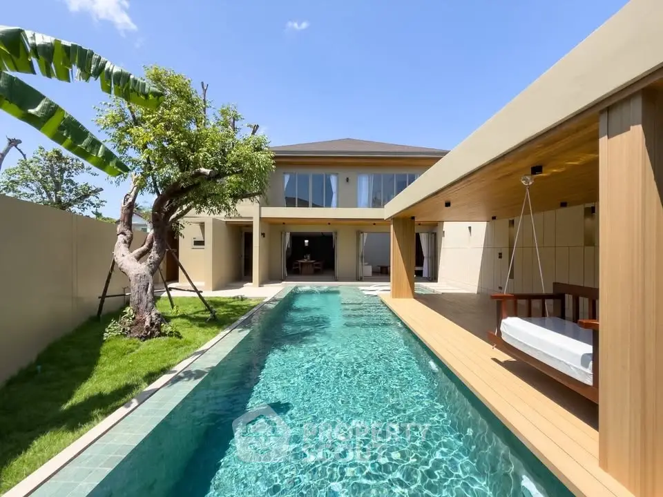 Luxurious modern villa with private pool and lush garden, perfect for relaxation and entertainment.