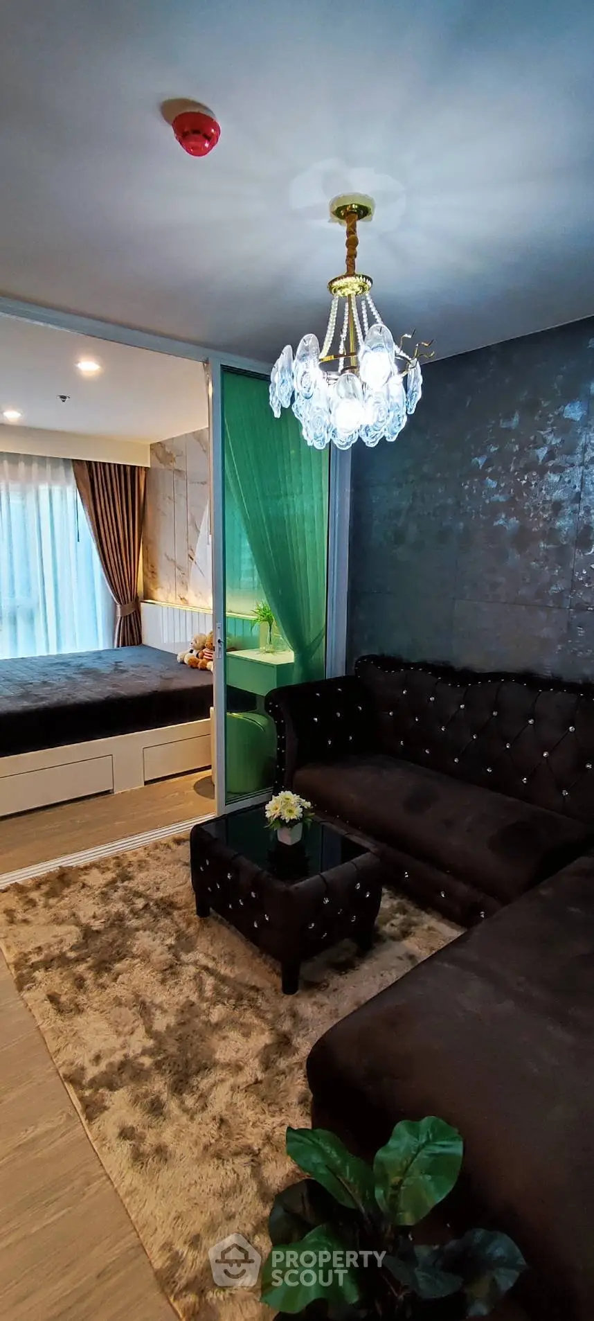 Luxurious living room with elegant decor and cozy bedroom view