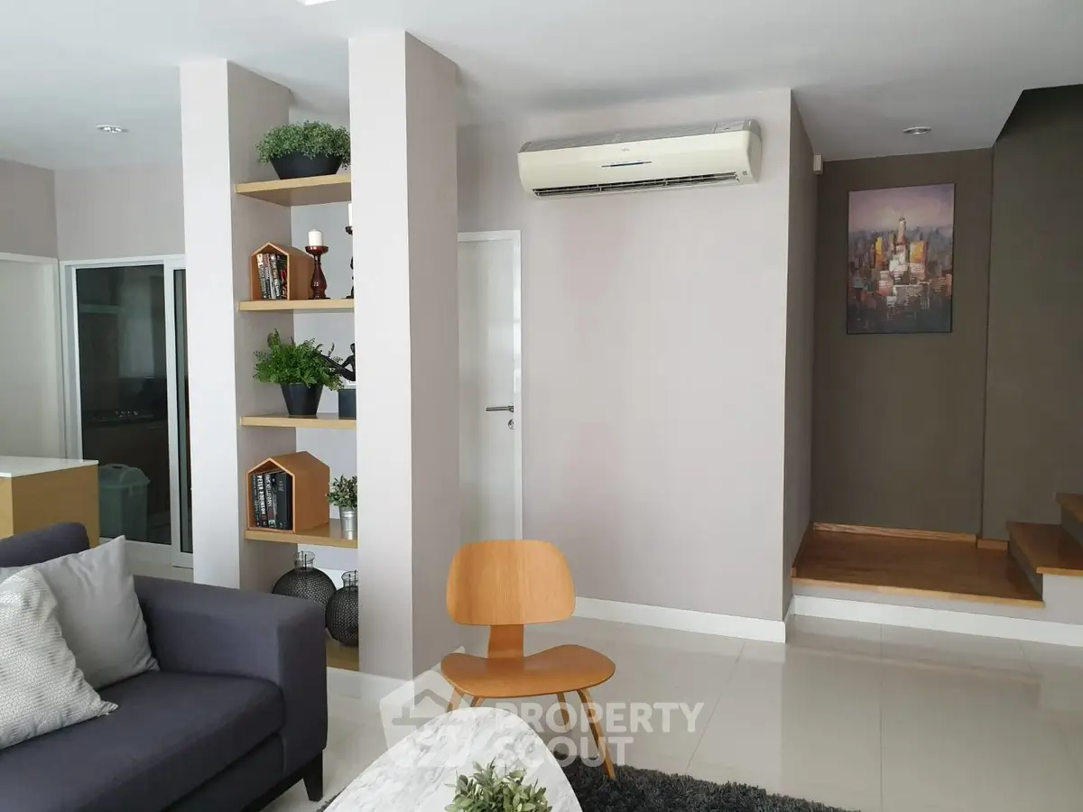 Modern living room with stylish decor and air conditioning