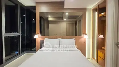 Luxurious bedroom with city view and modern lighting in high-rise apartment