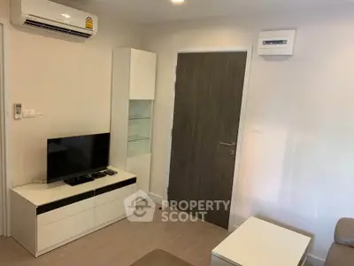 Modern living room with air conditioning and sleek furniture