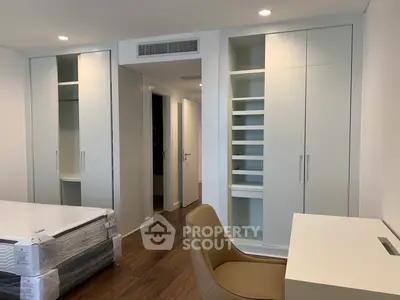 Modern bedroom with built-in wardrobes and sleek furniture design