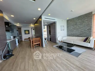 Spacious modern living room with open kitchen and stylish decor