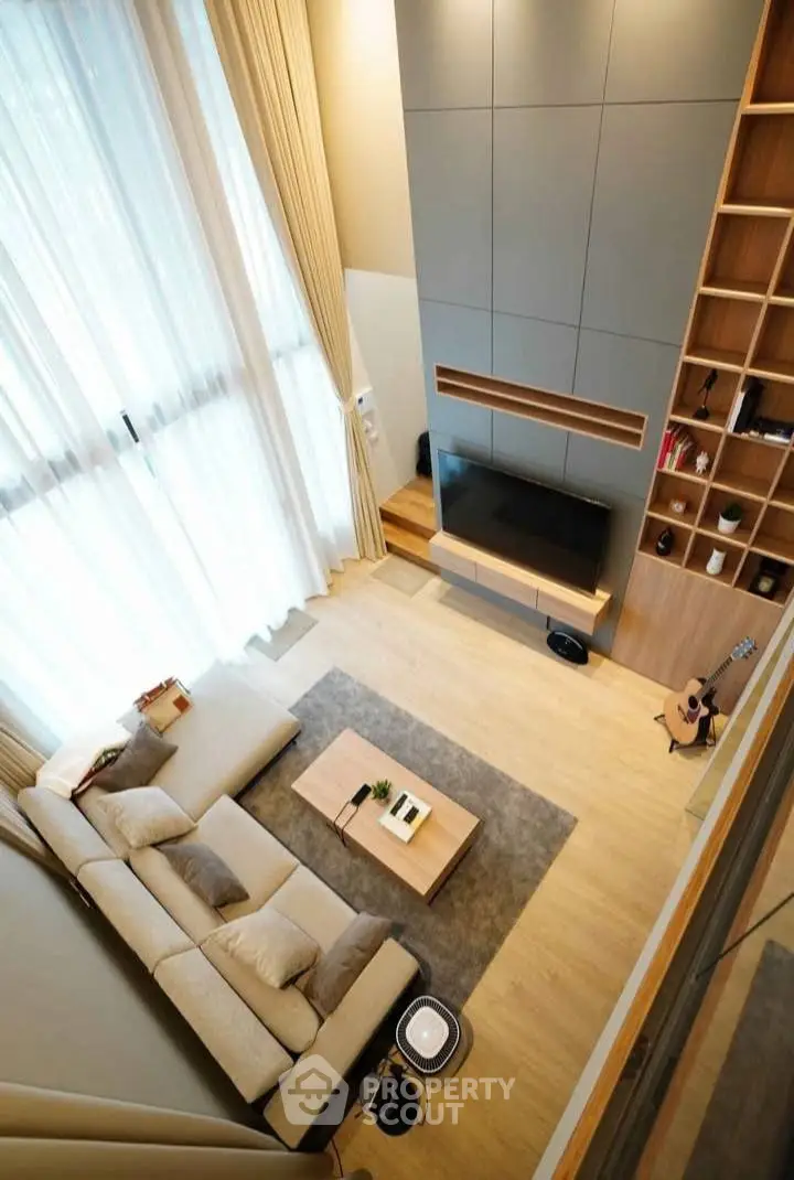 Spacious modern living room with high ceilings and elegant decor