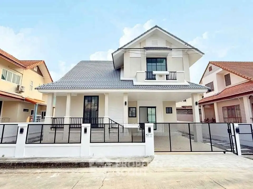 Stunning modern house with sleek design and spacious driveway in a serene neighborhood.