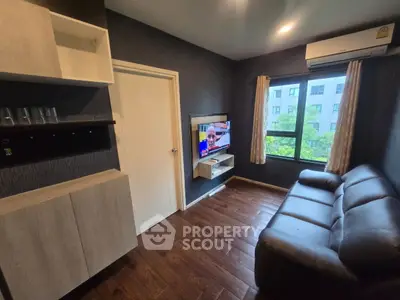Cozy living room with modern decor and large window view