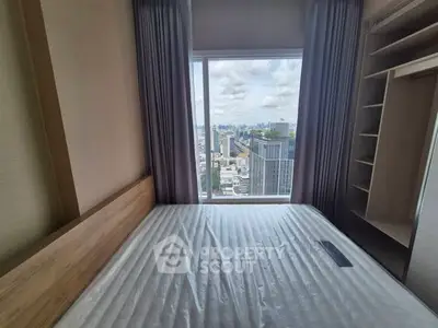 Modern bedroom with stunning city view from high-rise window