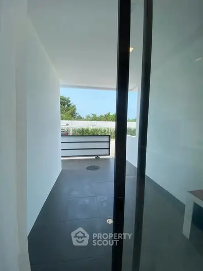 Modern minimalist balcony with sleek design and outdoor view
