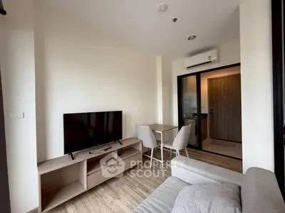 Modern living room with sleek furniture and a cozy atmosphere, perfect for relaxation and entertainment.