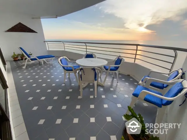 Stunning ocean view balcony with modern furniture and tiled flooring