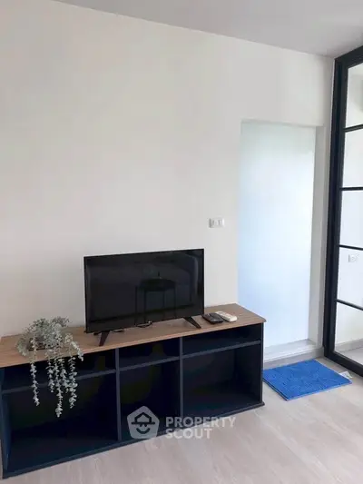 Modern living room with sleek TV stand and minimalist decor