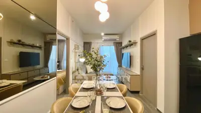 Modern apartment interior with stylish dining area and cozy living room